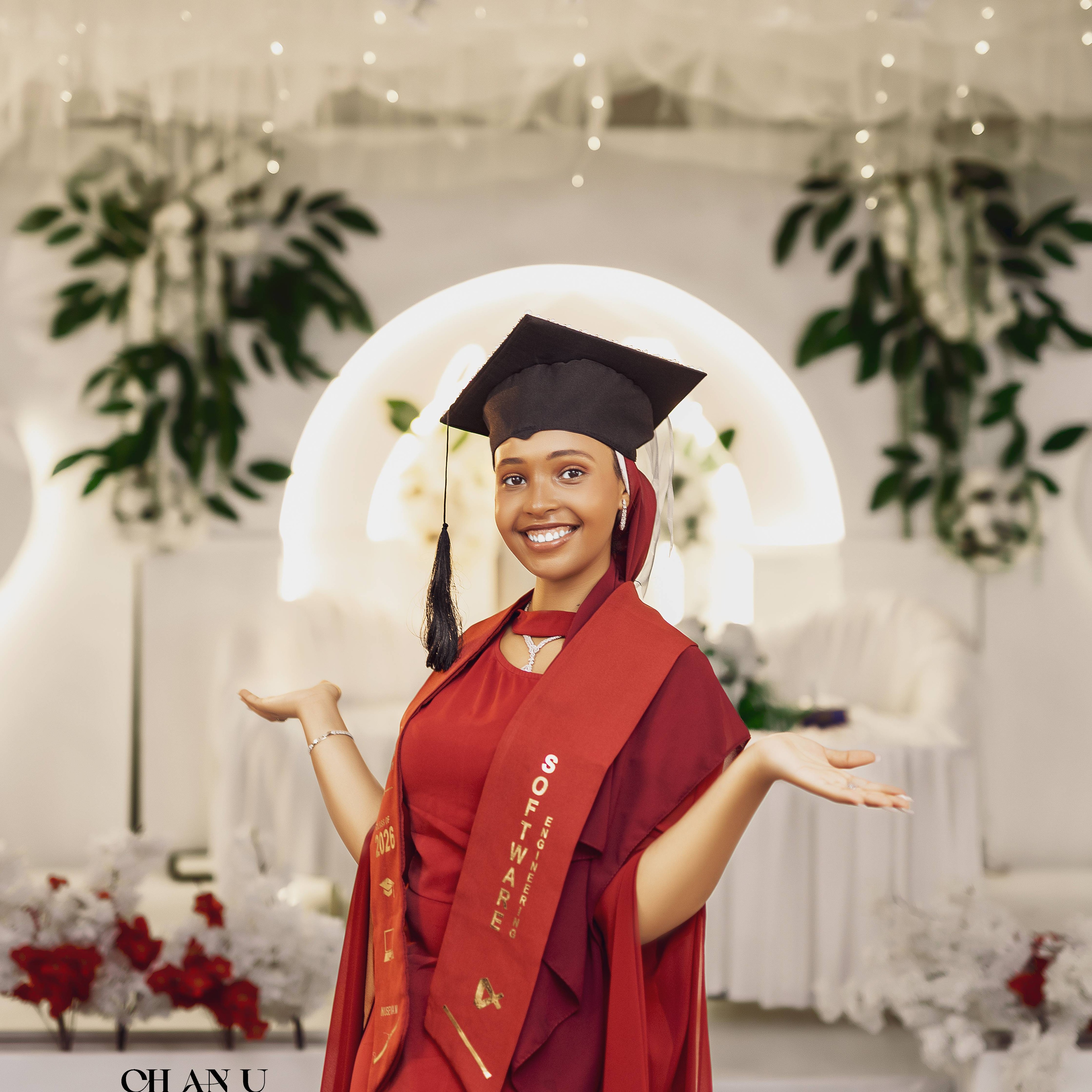 Haramaya University Class of 2026 graduation sash held by graduate